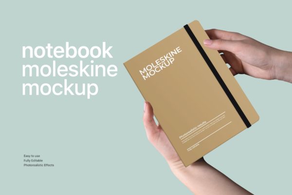 手握笔记本文具设计效果图样机模板 Notebook Mockup