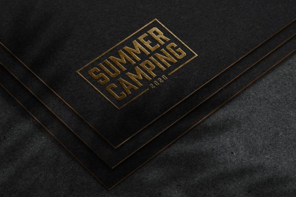 深色纸张浮雕工艺金色Logo样机 Embossed gold logo mockup on dark paper