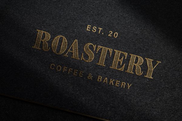 黑色纸张浮雕工艺金色Logo样机 Debossed Gold Logo Mockup on Dark Paper