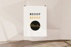 几何墙背景吊挂海报样机 Hanging poster on geometric wall background mockup